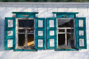 Two symmetric blue windows of ukrainian house