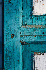 Blue wooden old door with cracking paint