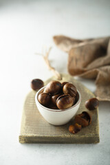 Roasted chestnuts in a white bowl
