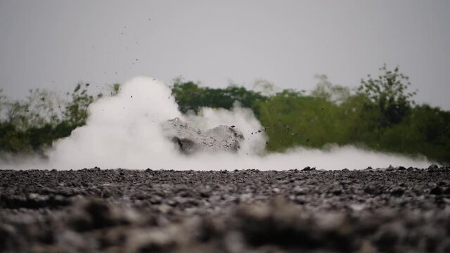 mud volcano with bursting bubble bledug kuwu. volcanic plateau with geothermal activity and geysers, slow motion Indonesia java. volcanic landscape