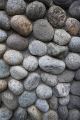 background of round gray smooth stones close-up for design