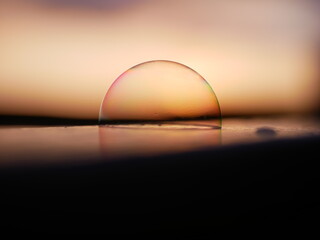 Fototapeta na wymiar Soap bubbles close-up in sundown light