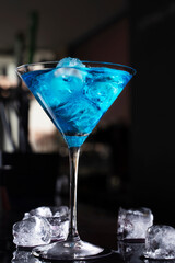 Barman preparing cocktail. Cocktail at the bar. Alcoholic drink at the night club..