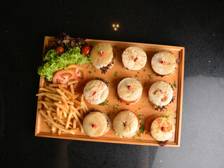 assorted mini burger canapés with meat and vegetable toast in party tray western bar halal menu