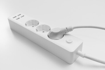 a versatile modern white extension cord with sockets and usb ports - obrazy, fototapety, plakaty