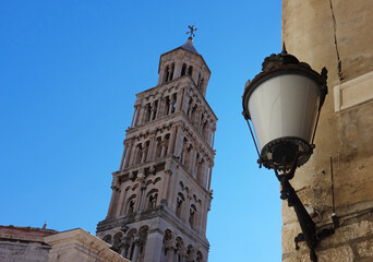Fototapeta na wymiar street lamp in front of the cathedral's steeple, Split, Croatia