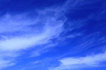 Obraz premium natural background blue sky with stretched stripes of clouds