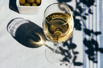  a glass of white wine on the table 