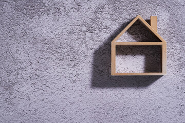 wooden model house on cement background