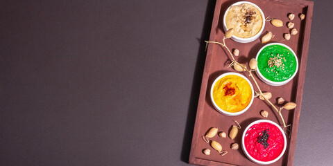 Colorful hummus bowls, healthy vegan dips