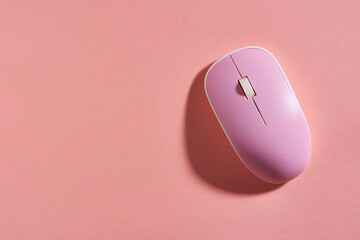 pink computer mouse on pink background