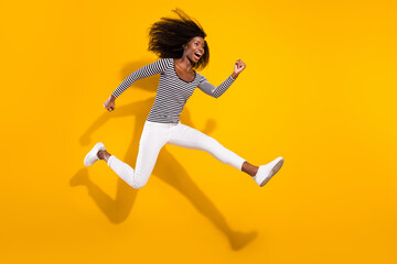 Fototapeta na wymiar Full length body size side profile photo woman jumping up running on sale isolated vibrant yellow color background