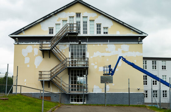 The photo shows a school building that receives a renovation