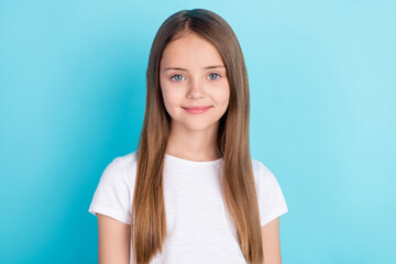Photo of nice brown hair small girl wear white t-shirt isolated on blue color background