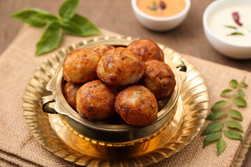 Paniyaram, Kuzhi paniyaram Gunta ponganalu paddu, guliyappa made of black lentils and rice deep...