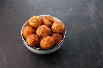 Paniyaram, Kuzhi paniyaram Gunta ponganalu paddu, guliyappa made of black lentils and rice deep fried snack or breakfast vegan vegetarian South Indian Kerala Tamil Nadu Karnataka Sri Lanka Lankan food