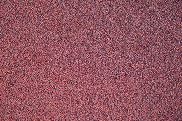 Fototapeta premium Closeup of red rubber floor covering for playground
