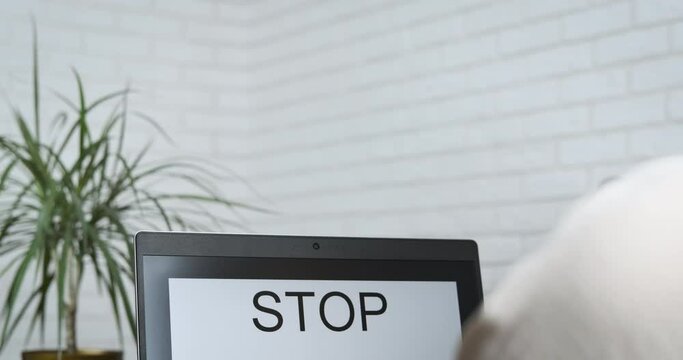 Stop 5G. Woman writes on the computer stop 5G. Humanity against new technologies.