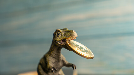dinosaur holding bitcoin in its mouth