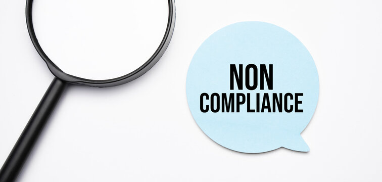 NON COMPLIANCE speech bubble and black magnifier isolated on the yellow background.