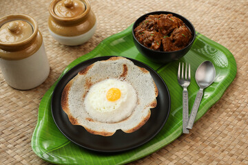 Sri lankan egg hopper, bittara aappa Appam popular breakfast Pancake Made With Fermented Rice Batter, Coconut Milk Sri Lanka South Indian  Kerala, Tamil Nadu. Indian veg food. 