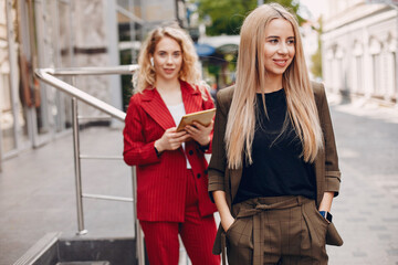 Two businesswomen working in a cafe