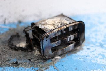 Toaster after fire. Household electrical appliance fire hazard