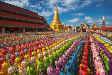 Naklejka premium Colorful Lamp Festival and Lantern in Loi Krathong at Wat Phra That Hariphunchai, Lamphun Province Thailand