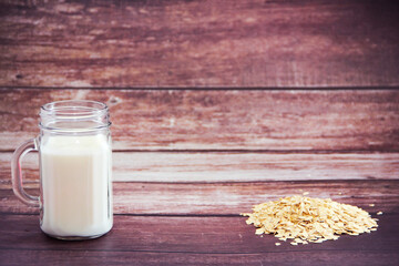 diet kefir in a glass mug and oat flakes