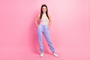Fototapeta na wymiar Full length photo of young attractive girl happy positive smile confident hands in pocket isolated over pastel color background