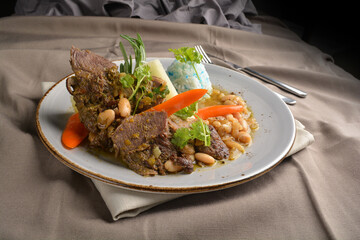 stewed beef steak with baked bean and blue pea butterfly flower rice Peruvian cuisine menu