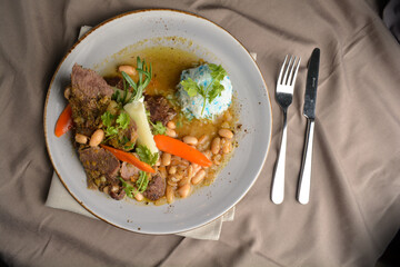 stewed beef steak with baked bean and blue pea butterfly flower rice Peruvian cuisine menu