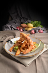 deep fried crispy tiger prawn and calamari with french fries Peruvian seafood cuisine menu