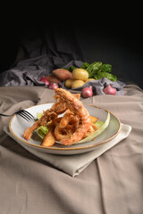deep fried crispy tiger prawn and calamari with french fries Peruvian seafood cuisine menu