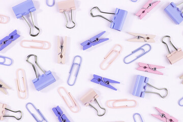 Pattern of stationery pins and paper clips close-up.