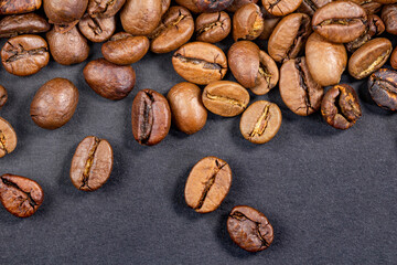Coffee beans on a black background close up