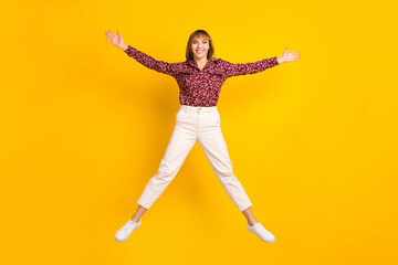 Fototapeta na wymiar Full length body size photo jumping woman careless like star isolated vivid yellow color background