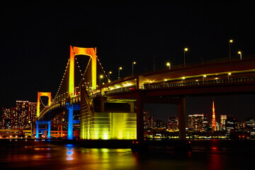 Fototapeta na wymiar colorful bridge with xmas rainbow lights on