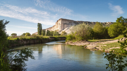 Fototapeta na wymiar Small river on the background of the White Rock