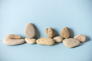 the nobility of pebbles -- or beach rocks artfully arranged on a fancy blue background