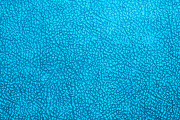 Old blue imitation leather. Dermantin. Close-up. Background. Texture.