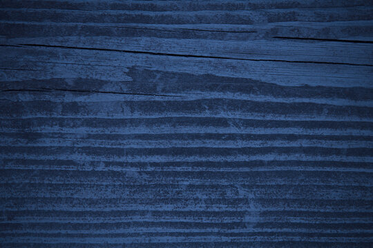 Old dark blue wood board. Close-up. Background. Texture.