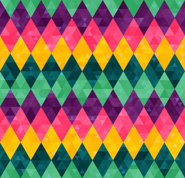 Abstract geometric seamless harlequin pattern from rows of rhombuses in green, yellow, pink and purple colors. Mardi Gras holiday poster backdrop, design, wallpaper, packaging, wrapping paper, cover.