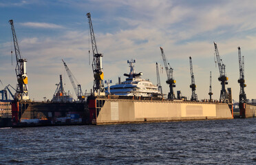 Dock and harbor cranes in Hamburg harbor in Germany