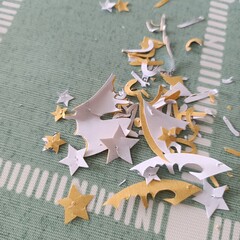 Star shape paper debris on the table after papercut