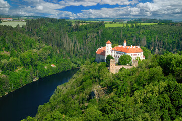 Old Moravian castle, standing on a rock promontory above the river Dyje against a summer blue sky...