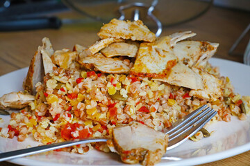 pieces of meat with porridge on a plate.