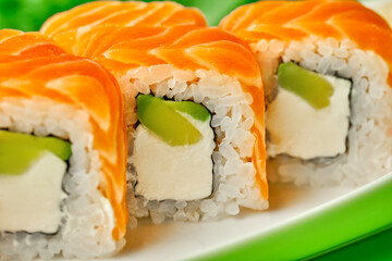 Philadelphia sushi roll with salmon and avocado. Close up, selective focus