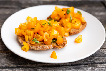 Friselle with yellow tomatoes. Italian fresh appetizer.