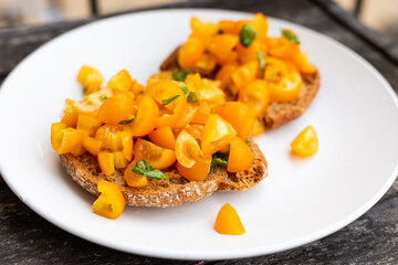 Friselle with yellow tomatoes. Italian fresh appetizer.